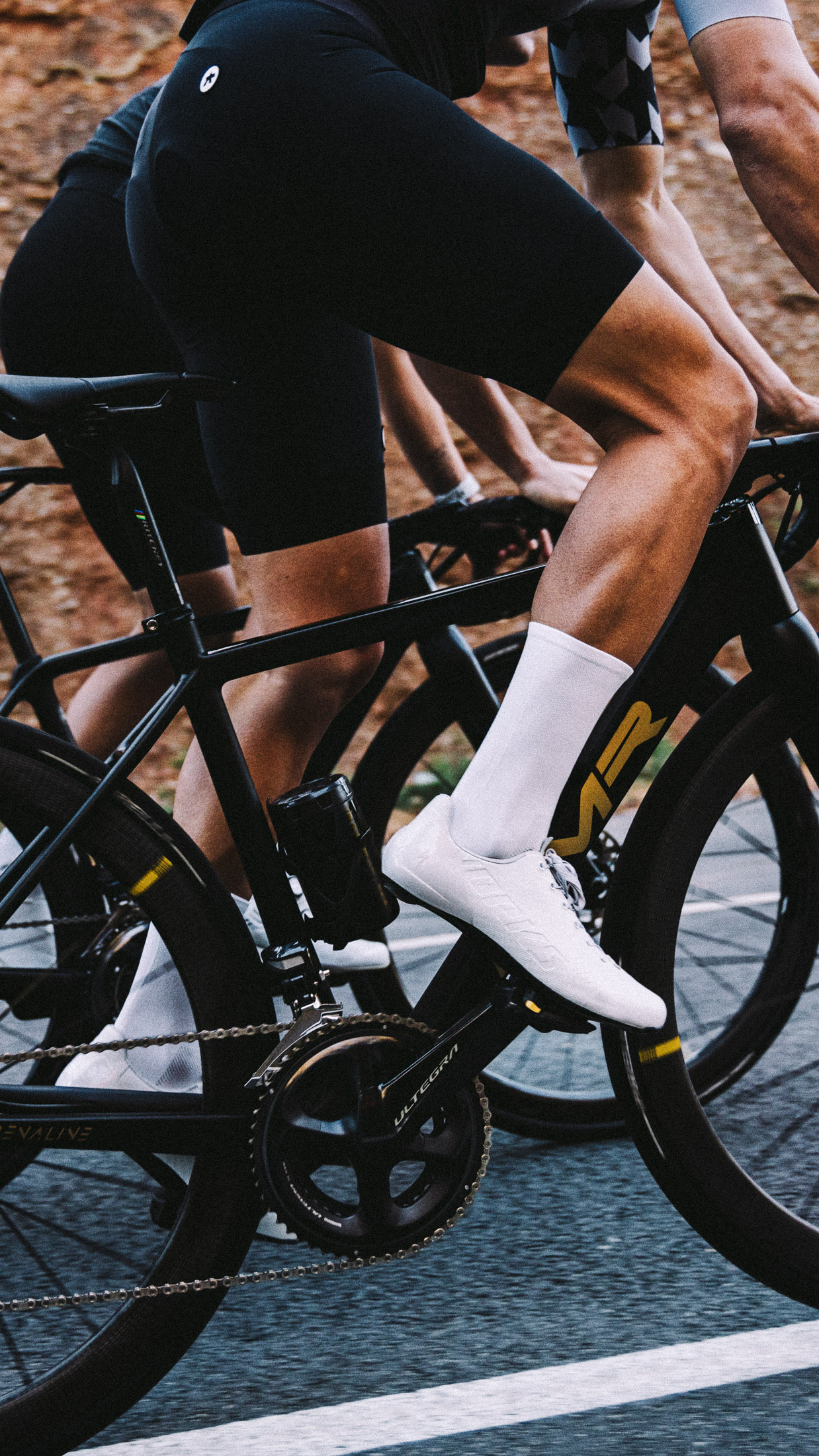 Close-up of Nologo’s white cycling socks featuring mesh construction on the top and high-density fabric at the footbed, perfect for warm-to-hot weather and ensuring durability and style.