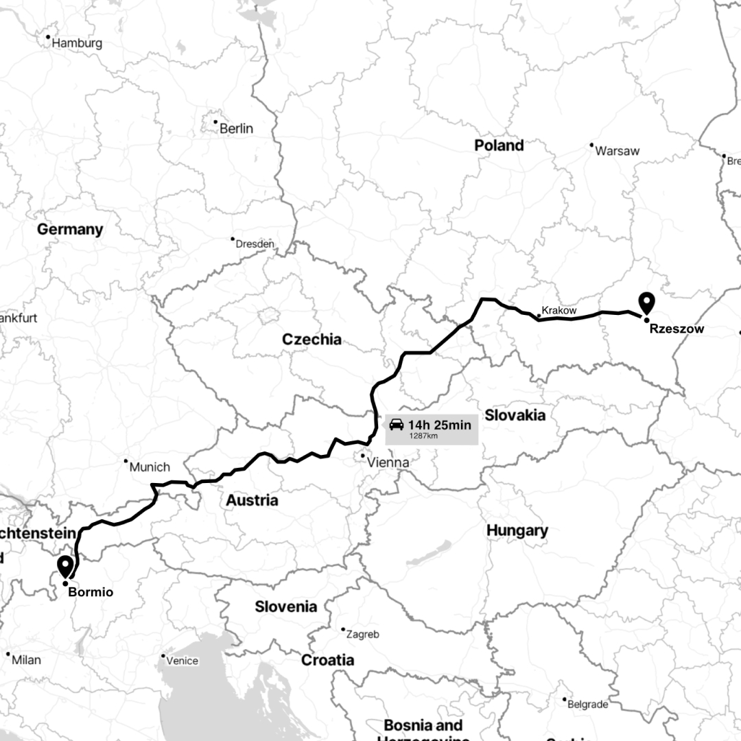 Planning the Route: The group meticulously planning their 1,300-kilometer drive from Rzeszów, Poland, to Bormio, Italy, over a casual coffee meeting.